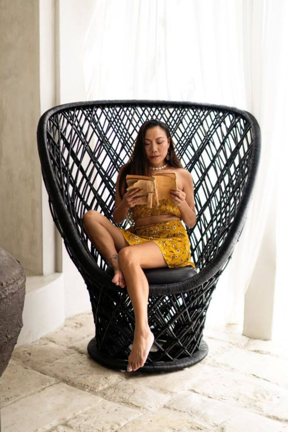 Rattan accent chair styled in living room interior
