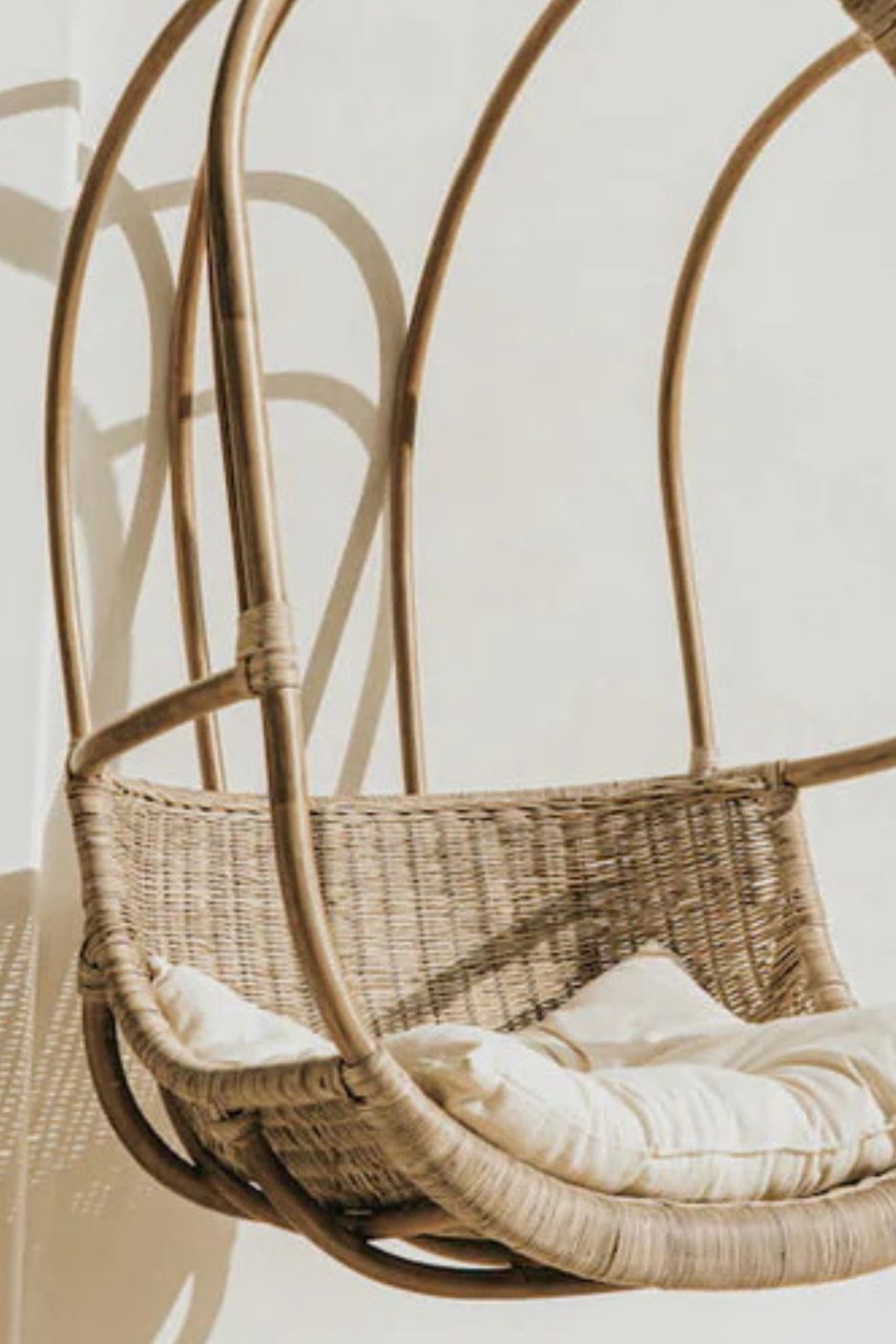 Koboo double handmade durable brown rattan hanging chair for indoor living rooms, covered terraces, patios, balconies, and outdoor gardens