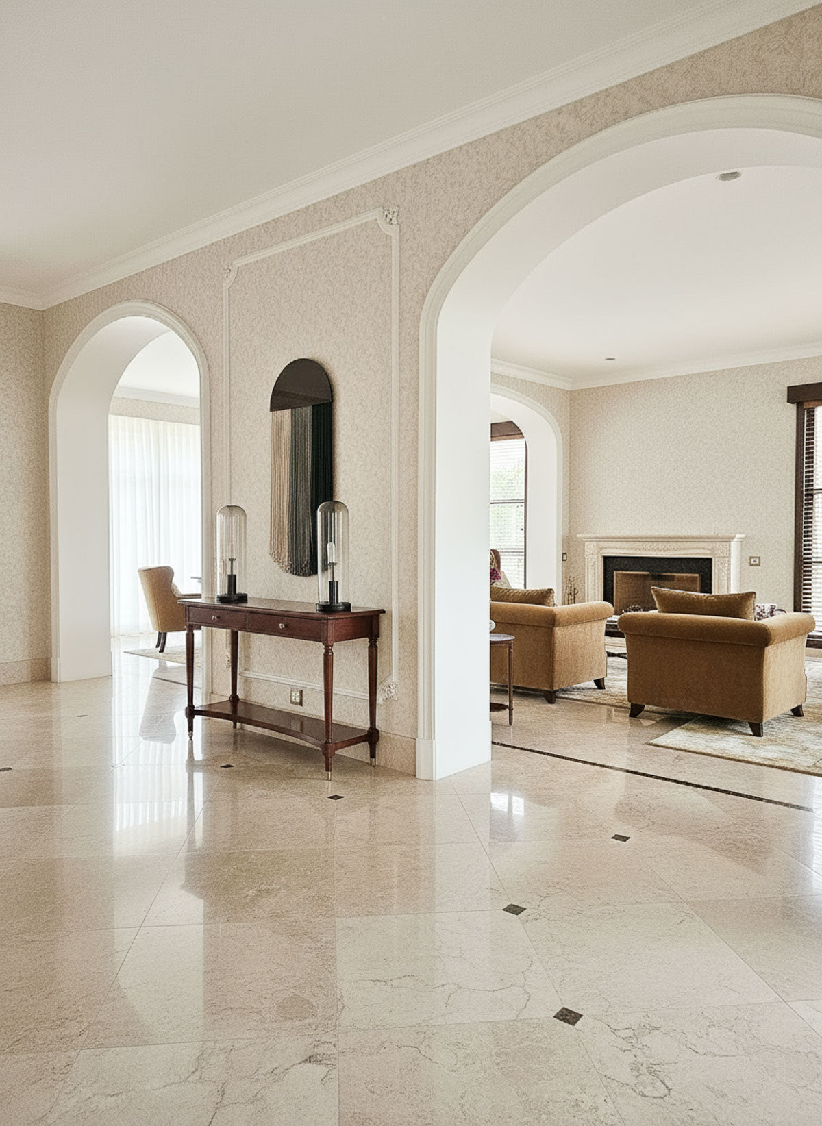 Luxurious interior with marble flooring, archways, and elegant furniture.