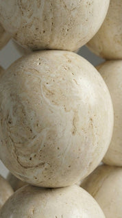 stone dining table with modern sculptural pedestal base
