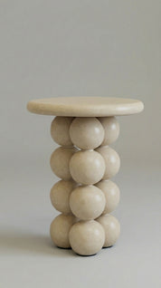 table with spherical design on a plain background