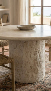 round travertine dining table with stone pedestal
