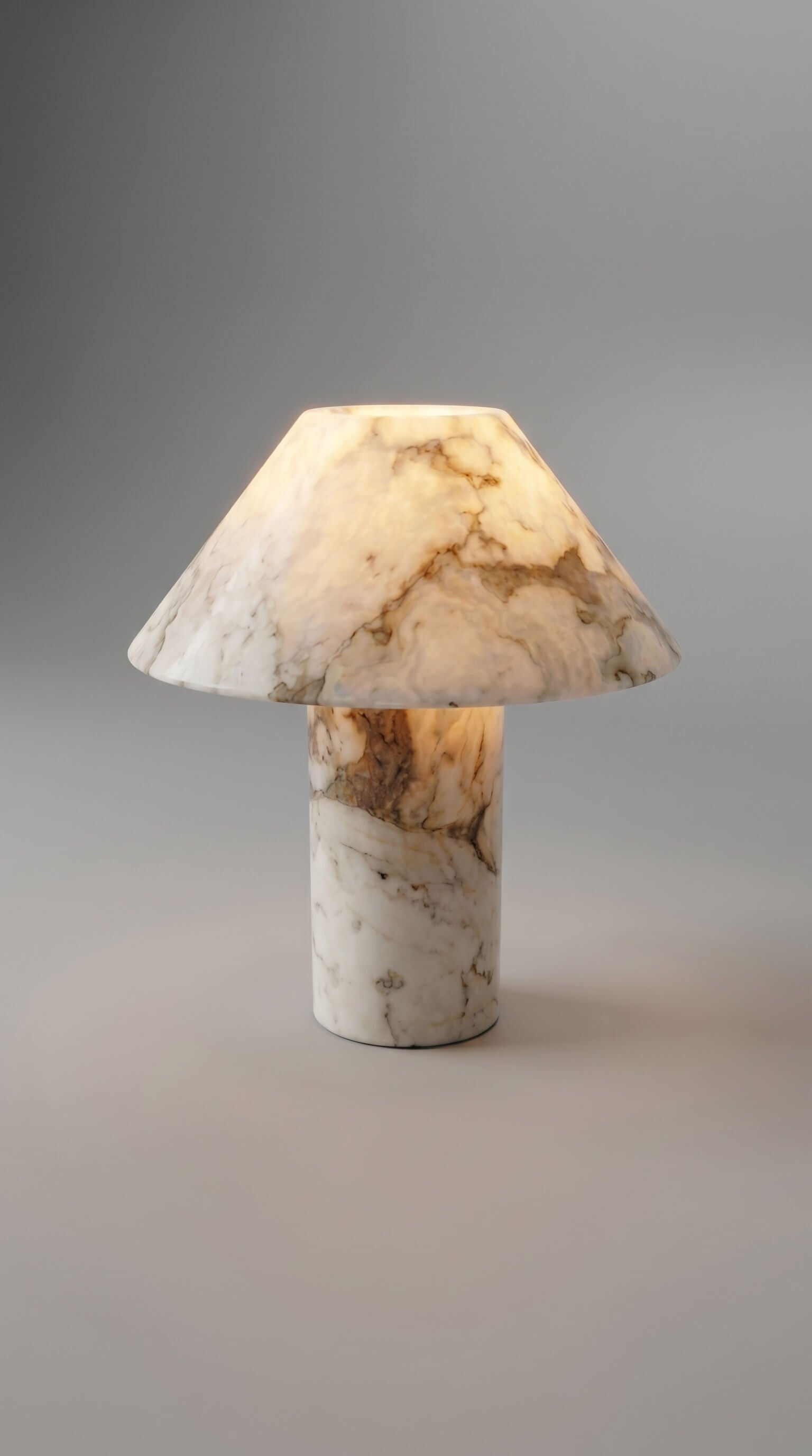 Marble-textured table lamp on a gray background