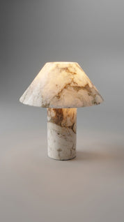 Marble-textured table lamp on a gray background