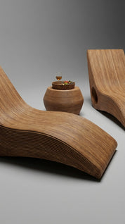 Wooden lounge chairs and side table on a gray background