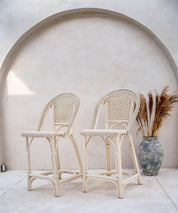 Woven rattan bar stool chair with curved base
