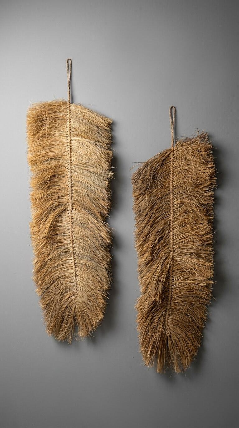 Two feather dusters against a gray background