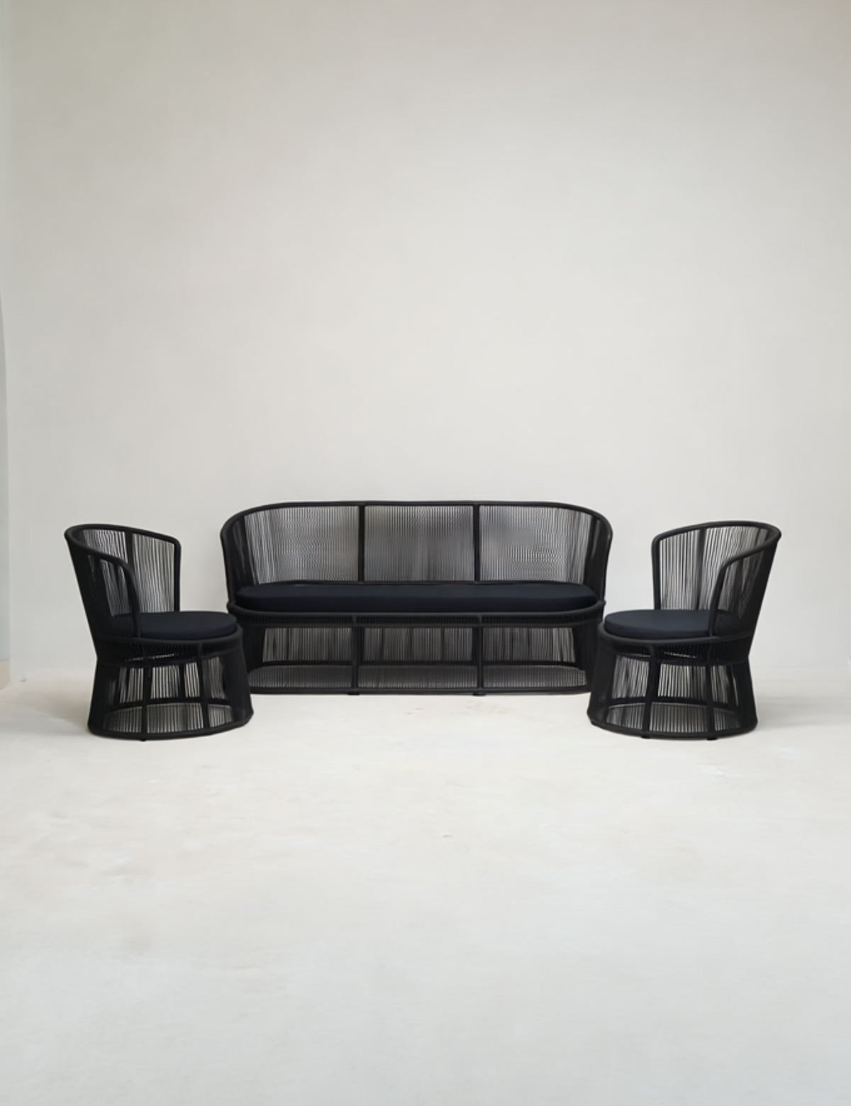 Black mesh outdoor furniture set on a white background