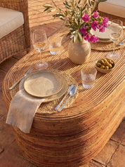 Rattan coffee table with organic curved silhouette
Natural rattan coffee table in coastal style interior