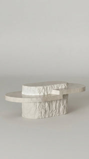 Marble-patterned coffee table on a plain background