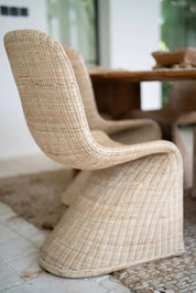 Oriana Collection handmade rattan chair with modern curved design, unique craftsmanship