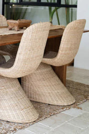 Oriana Collection handmade rattan chair with modern curved design, unique craftsmanship