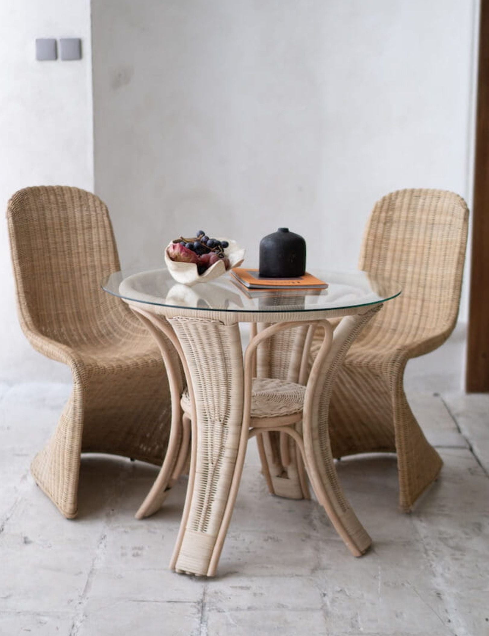 Oriana Collection handmade rattan chair with modern curved design, unique craftsmanship
