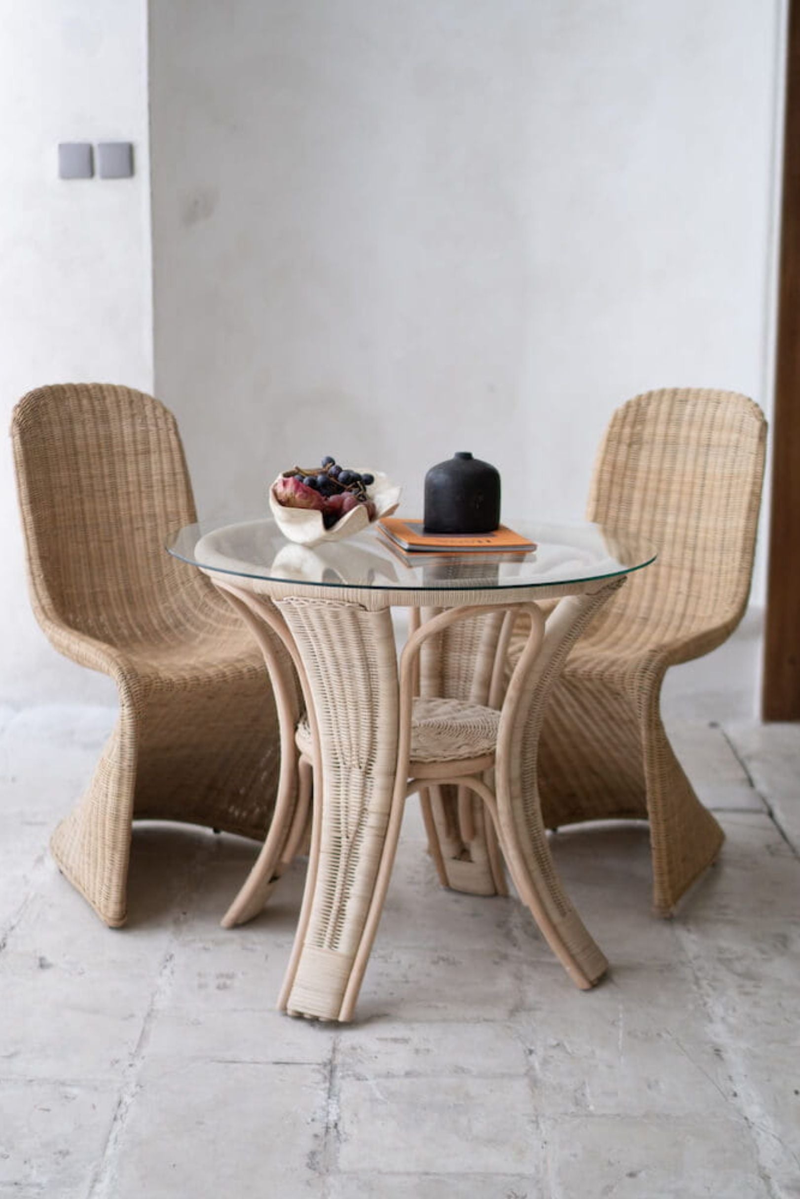 Oriana Collection handmade rattan chair with modern curved design, unique craftsmanship