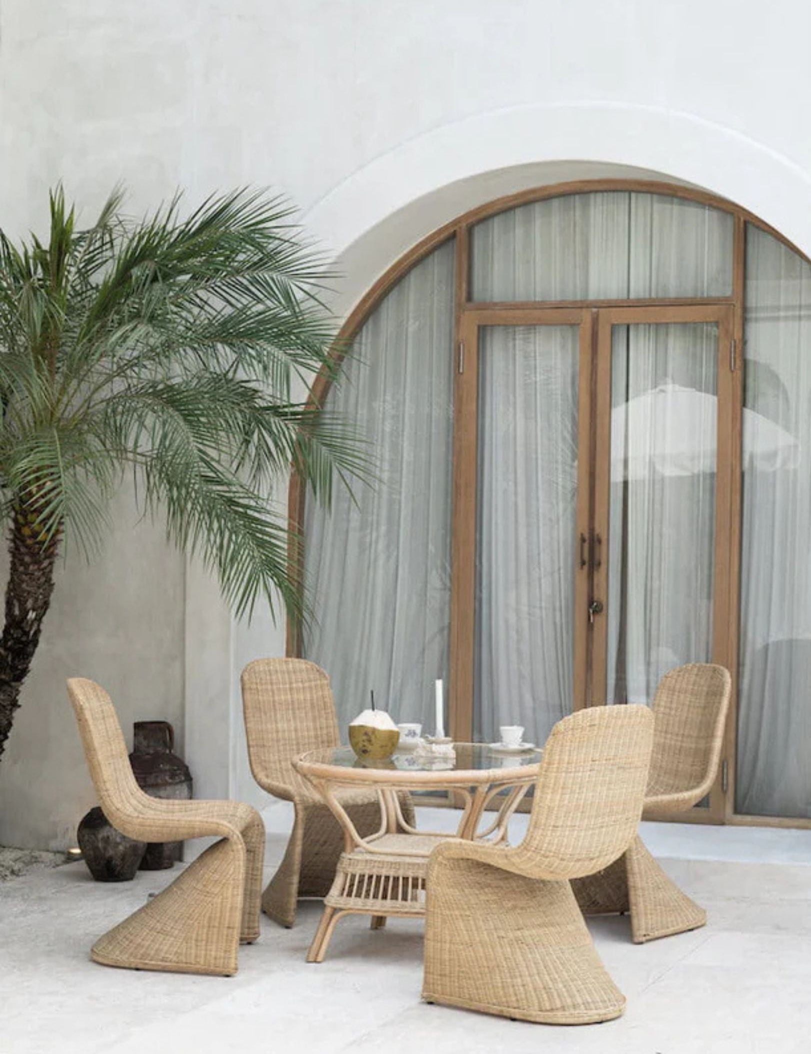 Oriana Collection handmade rattan chair with modern curved design, unique craftsmanship