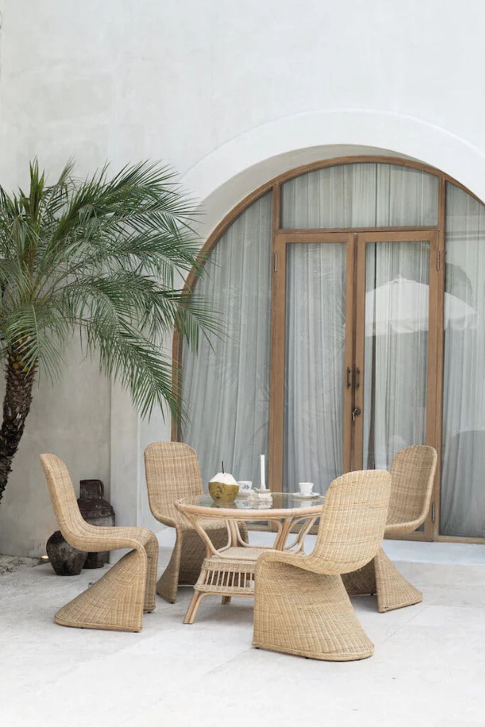 Oriana Collection handmade rattan chair with modern curved design, unique craftsmanship