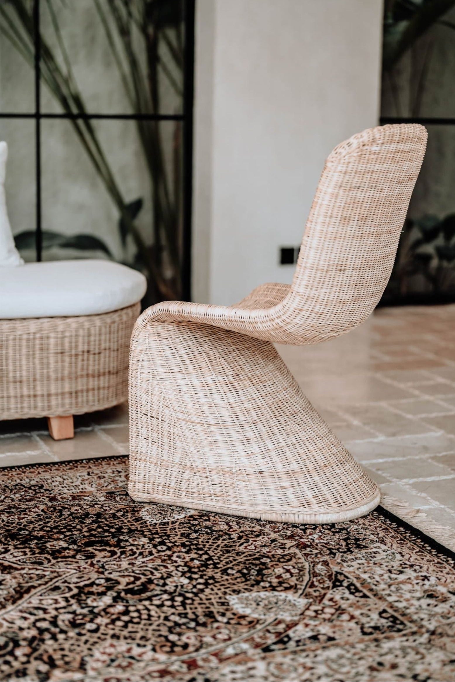 Oriana Collection handmade rattan chair with modern curved design, unique craftsmanship