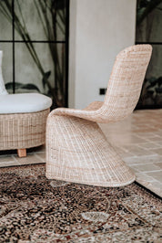 Oriana Collection handmade rattan chair with modern curved design, unique craftsmanship