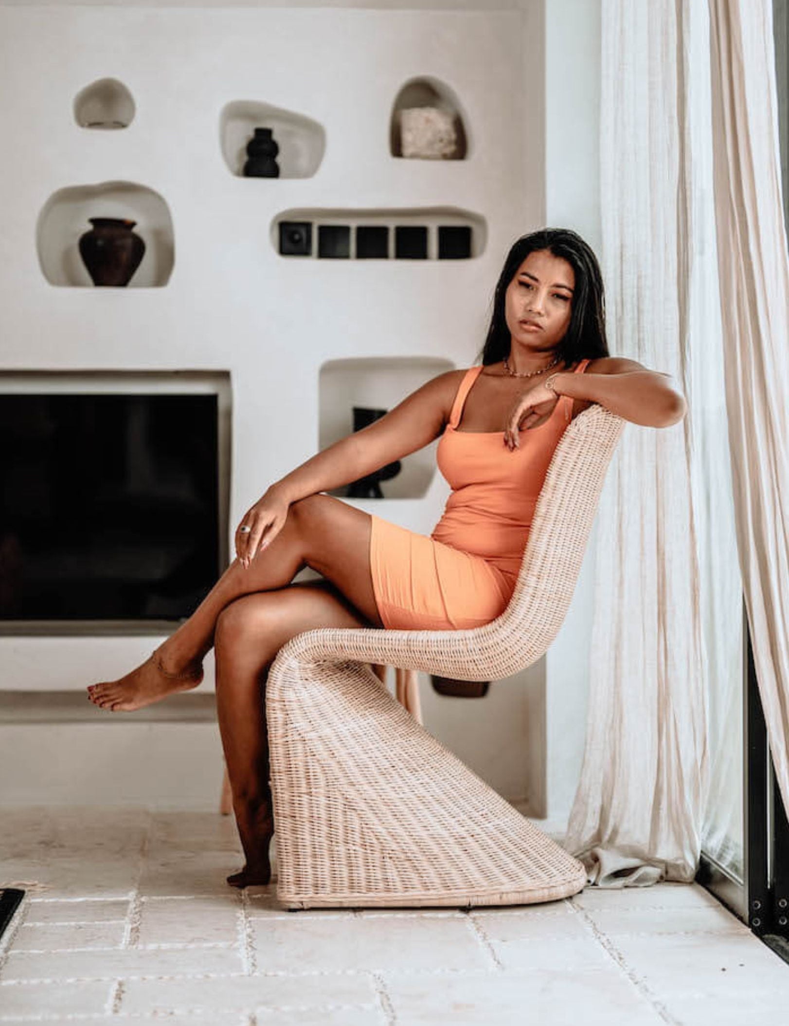 Oriana Collection handmade rattan chair with modern curved design, unique craftsmanship