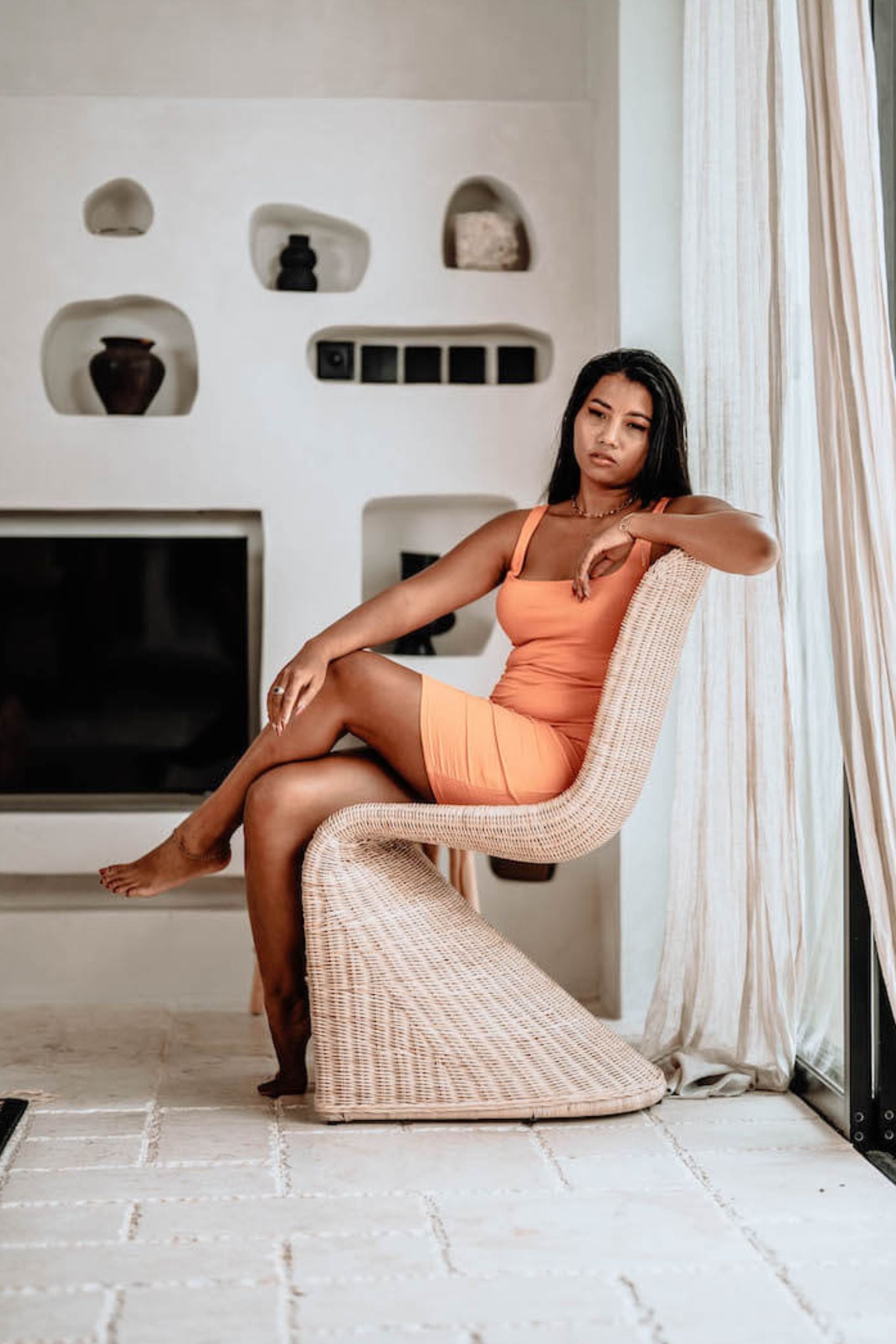 Oriana Collection handmade rattan chair with modern curved design, unique craftsmanship