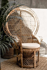 Peacock rattan chair with high back and cream cushion, handcrafted from natural rattan, perfect oversized boho accent for indoor or covered outdoor spaces