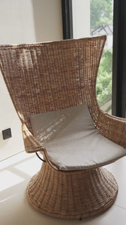 Rattan accent chair with minimalist frame
