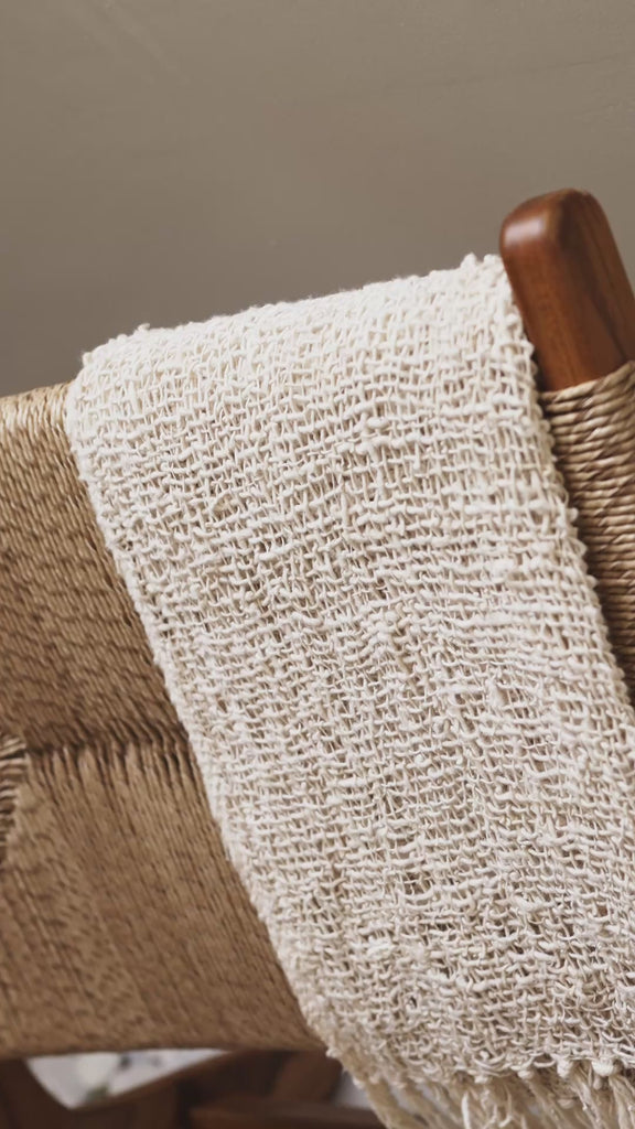 Solid teak wood lounge chair side view
styled in bright interior
