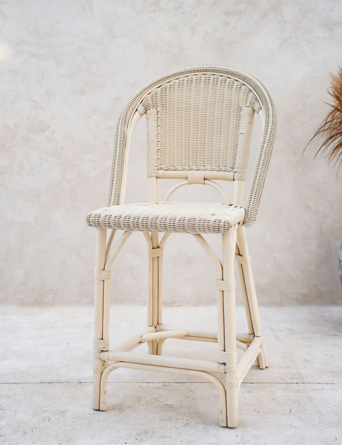 Natural rattan chair with woven seat detail
