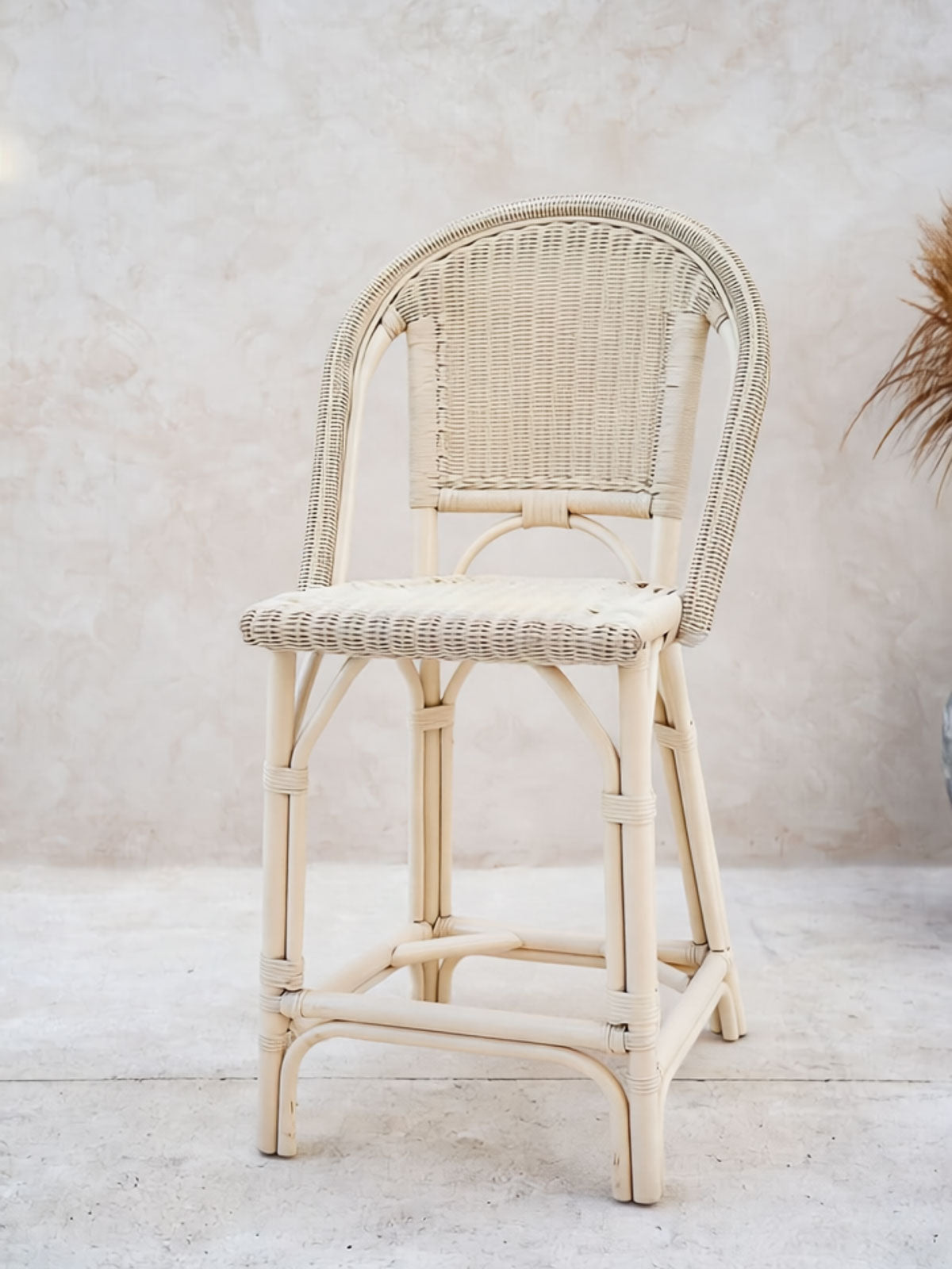 Natural rattan chair with woven seat detail
