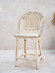 Natural rattan chair with woven seat detail
