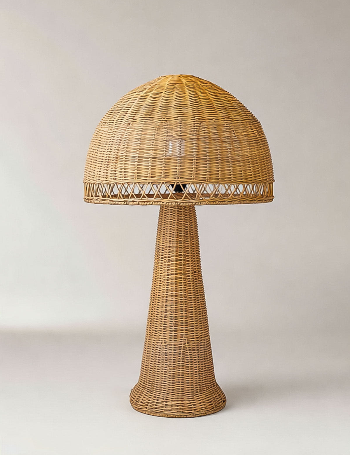 Wicker table lamp with a textured design on a light background