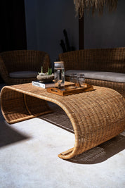 Natural rattan coffee table in coastal style interior
