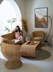 Sculptural rattan coffee table in neutral interior
