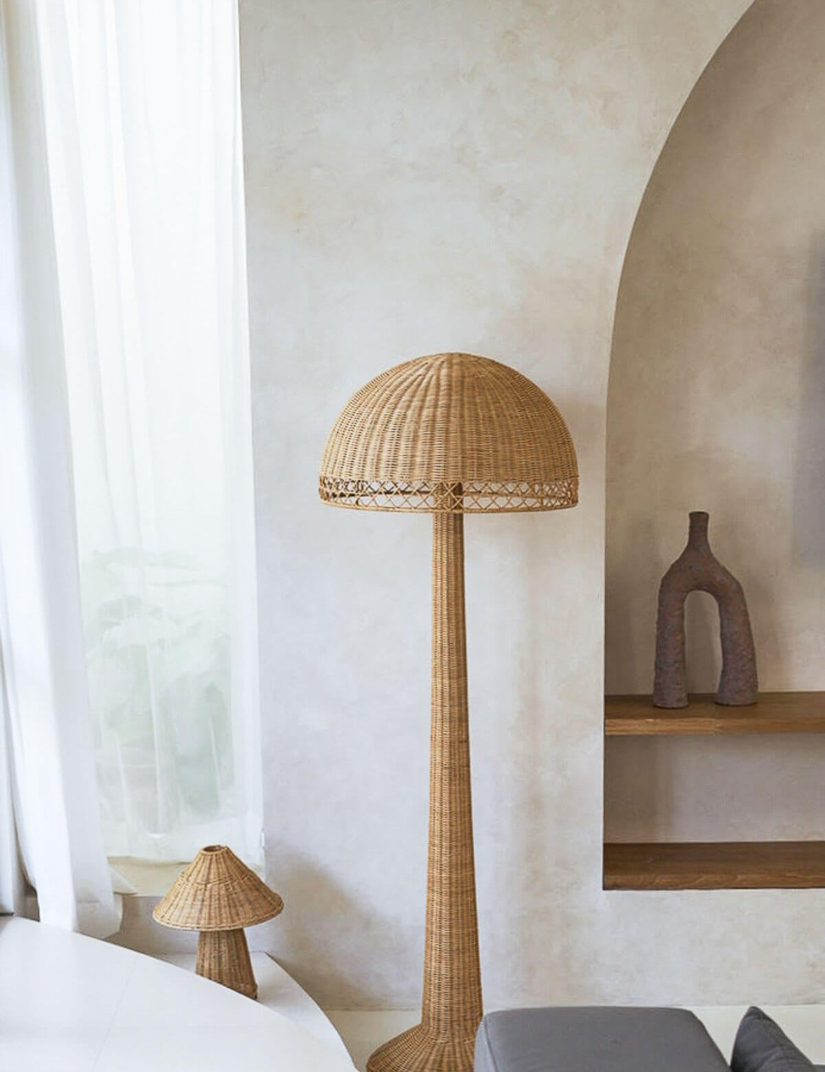 Woven floor lamp in a room with neutral decor