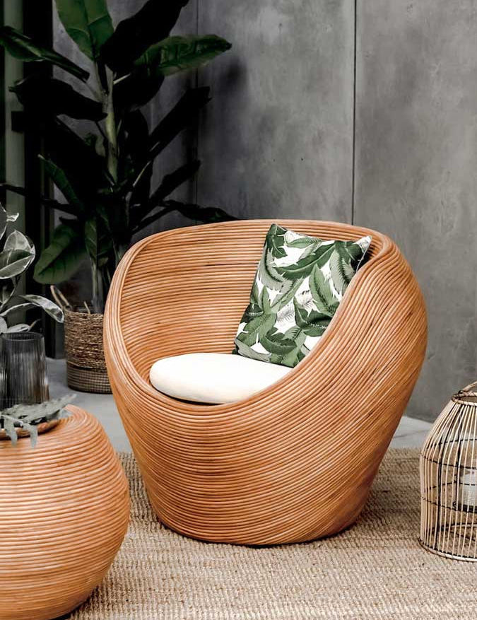 Handmade rattan armchair in cognac brown with boho style, perfect for cozy living spaces