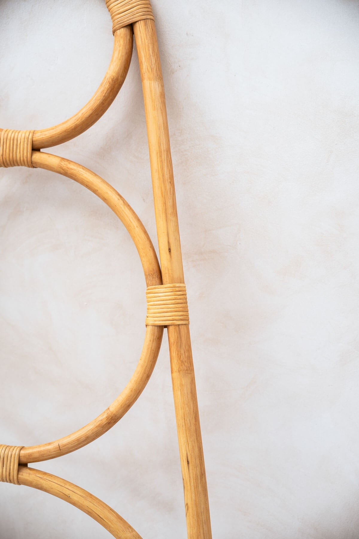Close-up of a wicker chair backrest on a light background