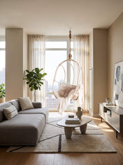 Sculptural rattan hanging chair with rounded base