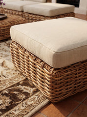Close-up of woven rattan pattern on chair
Sculptural rattan lounge seating in living room