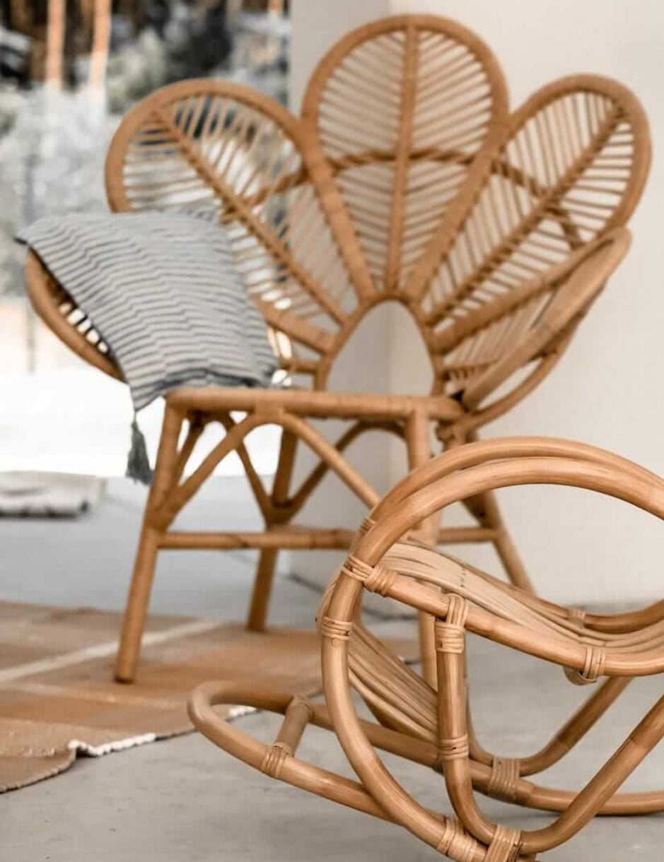Rattan Monna Flower Chair featuring a handcrafted petal-shaped backrest and natural rattan weave, offering elegant bohemian style for indoor or outdoor spaces