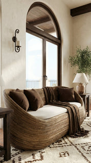 Cozy living room with a wicker sofa, cushions