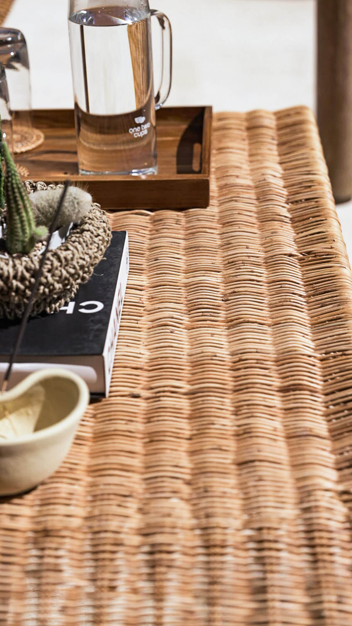 Sculptural rattan coffee table with rounded base
