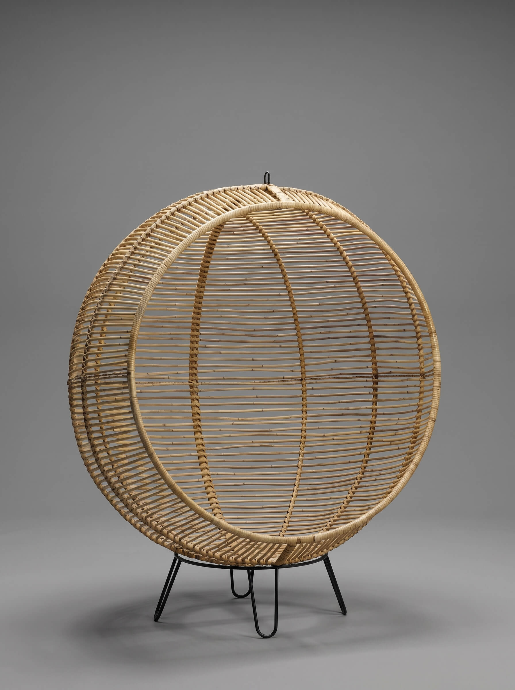Rattanround chair styled beside lounge chair
Handcrafted rattan chair with woven texture