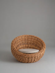 Rattan lounge chair styled in coastal interior
Curved rattan
