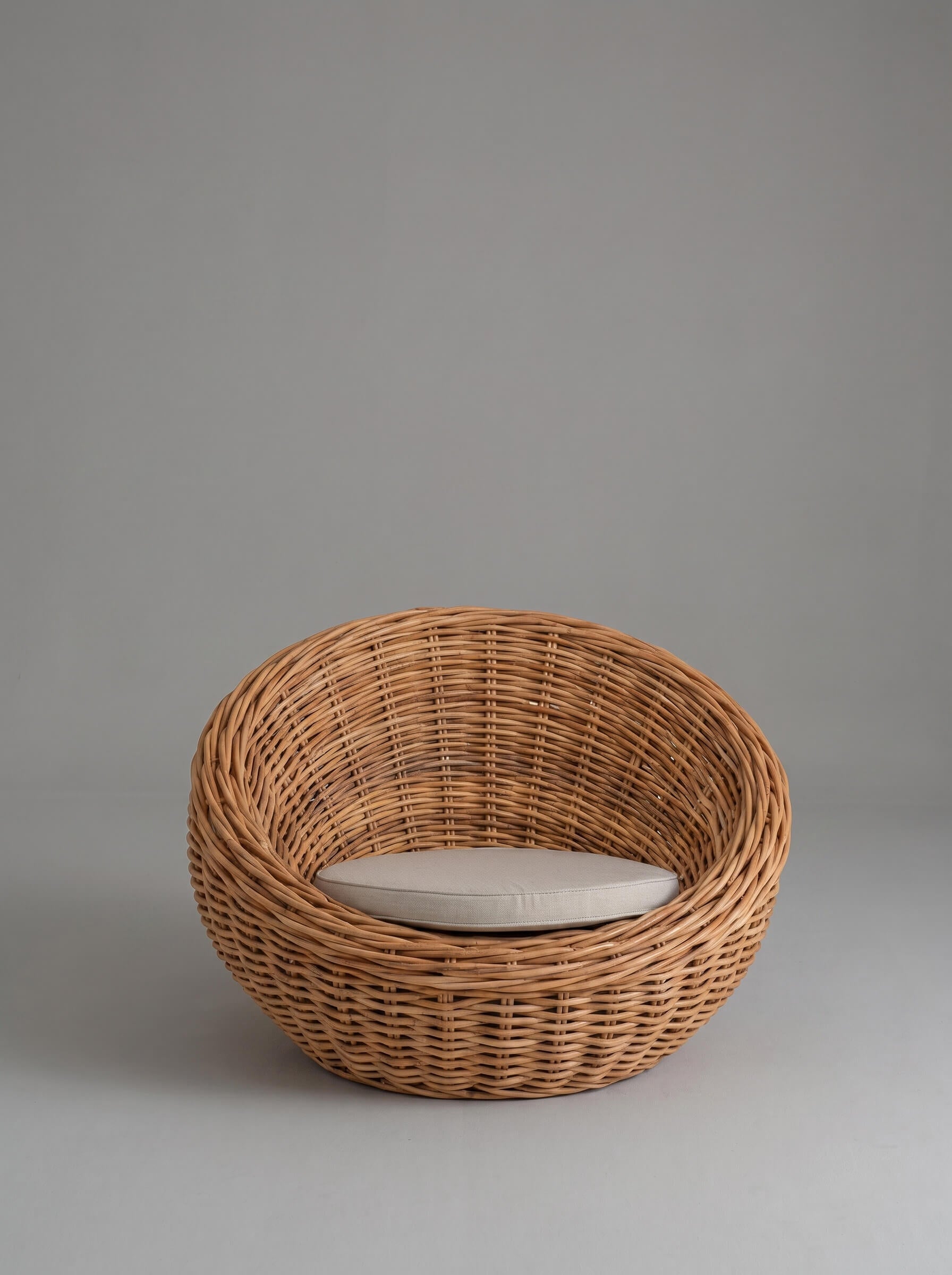 Rattan lounge chair styled in coastal interior
Curved rattan