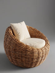 A round woven rattan armchair with a tall backrest, upholstered in natural beige fabric cushions, set against a solid gray studio background.