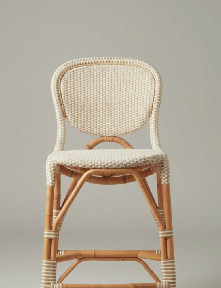 Wicker chair with a white woven backrest on a neutral background