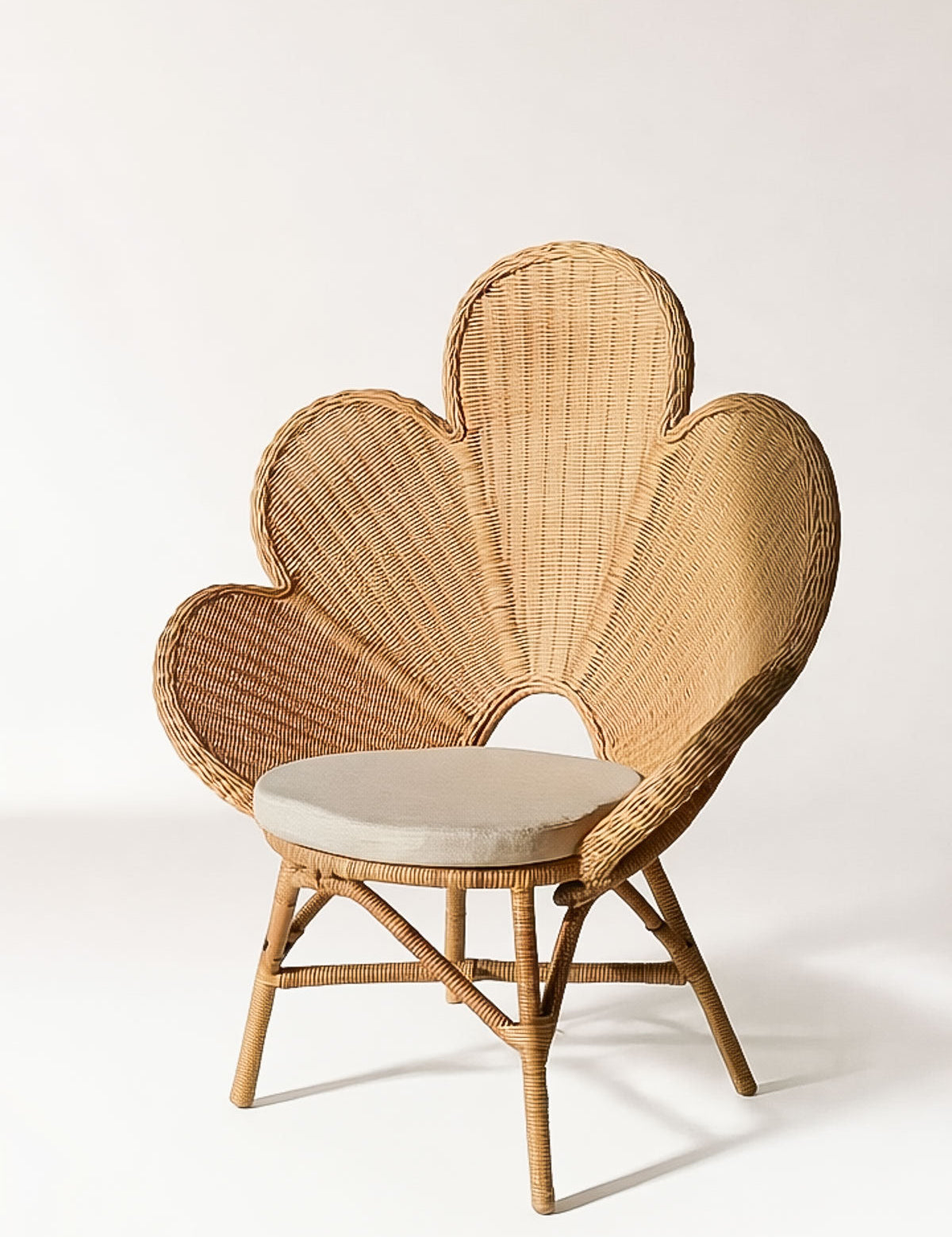 Sculptural rattan lounge chair with organic silhouette
