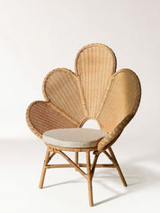 Sculptural rattan lounge chair with organic silhouette
