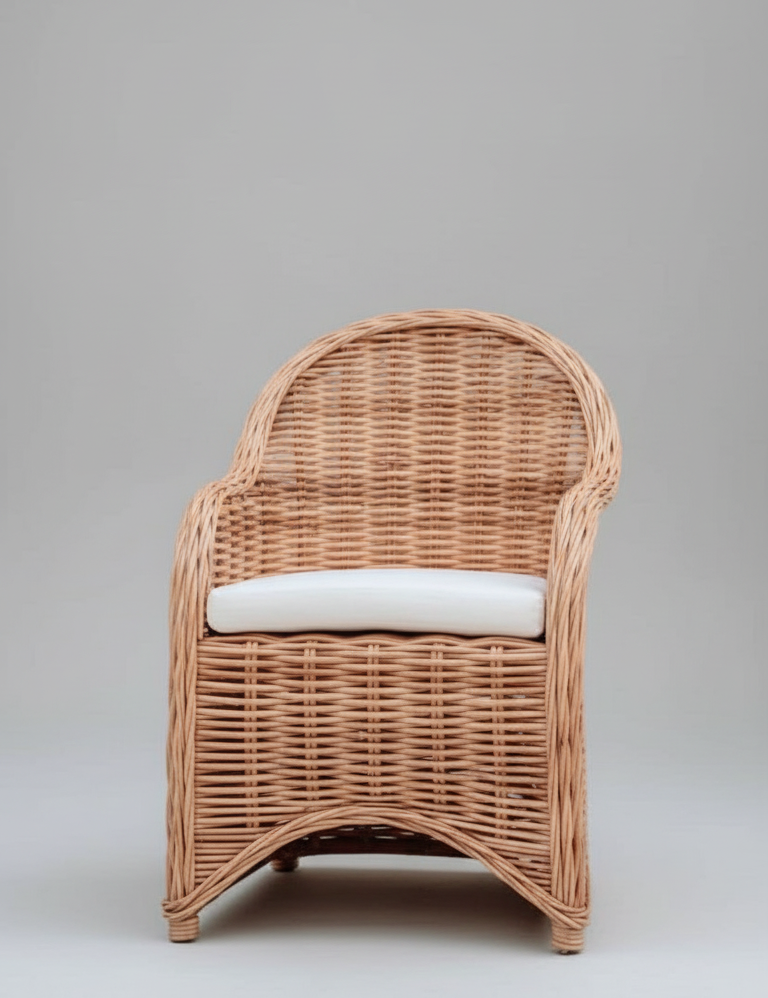Wicker armchair with a white cushion on a gray background