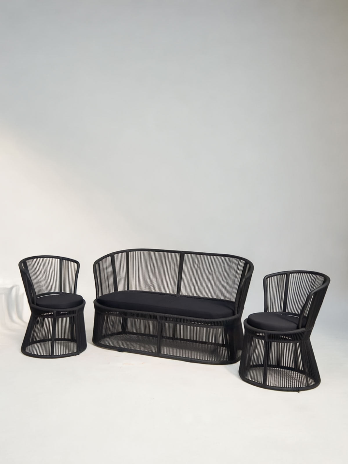 Black mesh outdoor furniture set on a white background